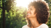 Close up side portrait of beautiful confident woman laughing in nature Close up side portrait of beautiful confident woman laughing in nature