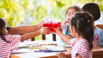 Children with red beverages Children with red beverages
