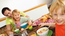 Photo of a family at breakfast Photo of a family at breakfast