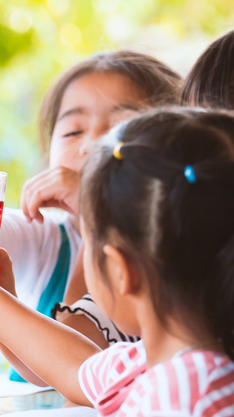 Children with red beverages Children with red beverages